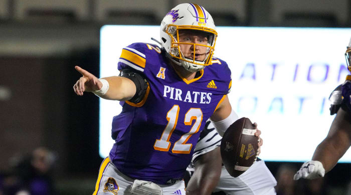 East Carolina QB Holton Ahlers points while holding the ball